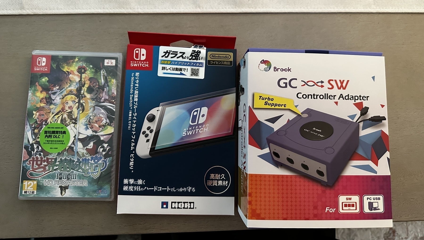 The Nintendo Switch game Etrian Odyssey Origins Collection in its box &10;Switch blue light screen protector in its box &10;GameCube controller adapter in its box 